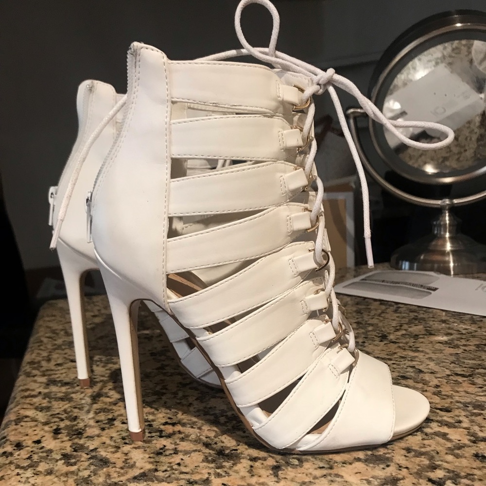 White lace-up heels. New condition.
